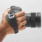 hand holding camera with peak design cltch