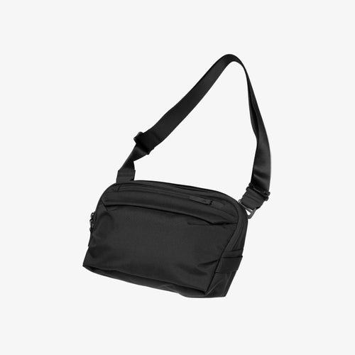 Black Toshi 5-liter shoulder bag with a strap
